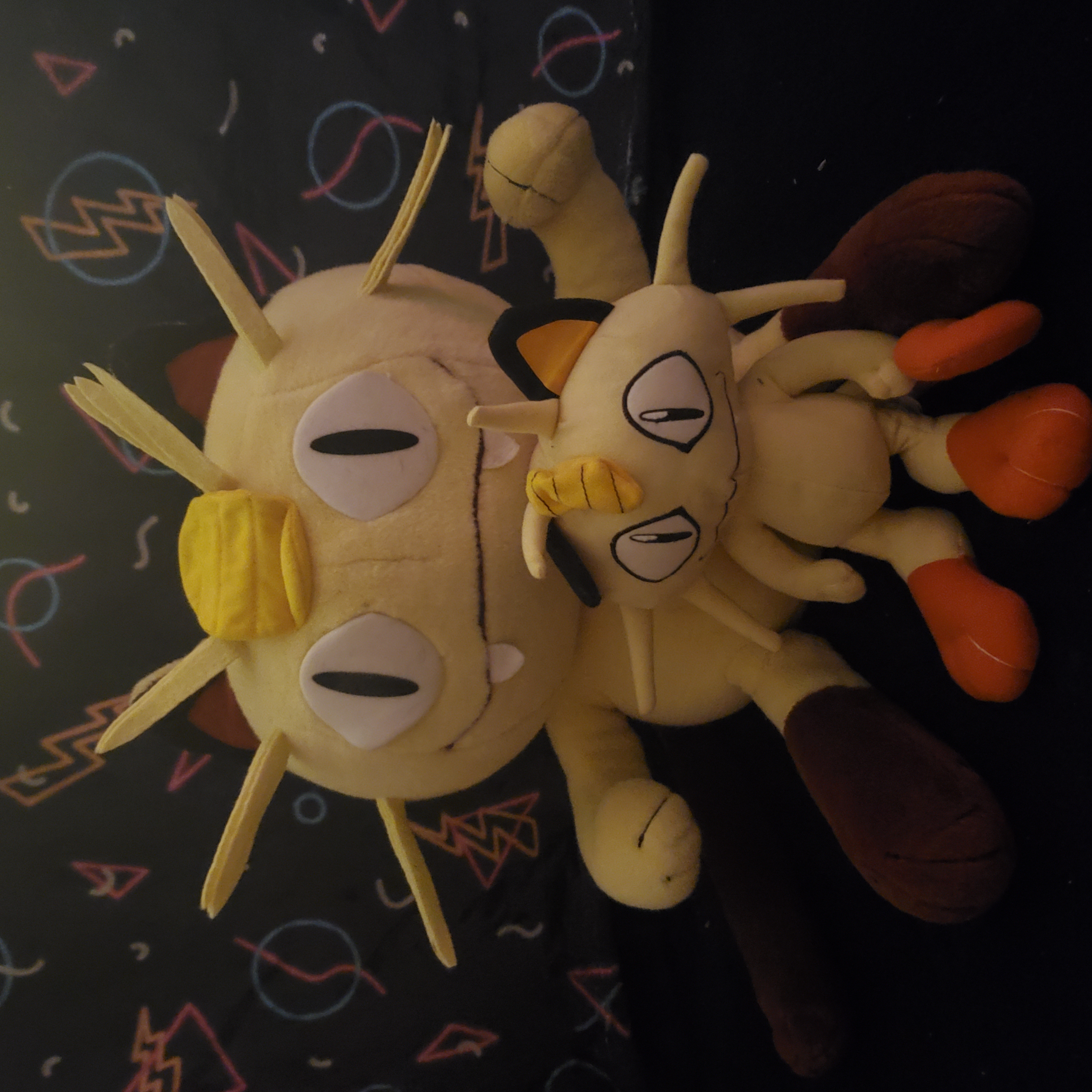 two meowth plush