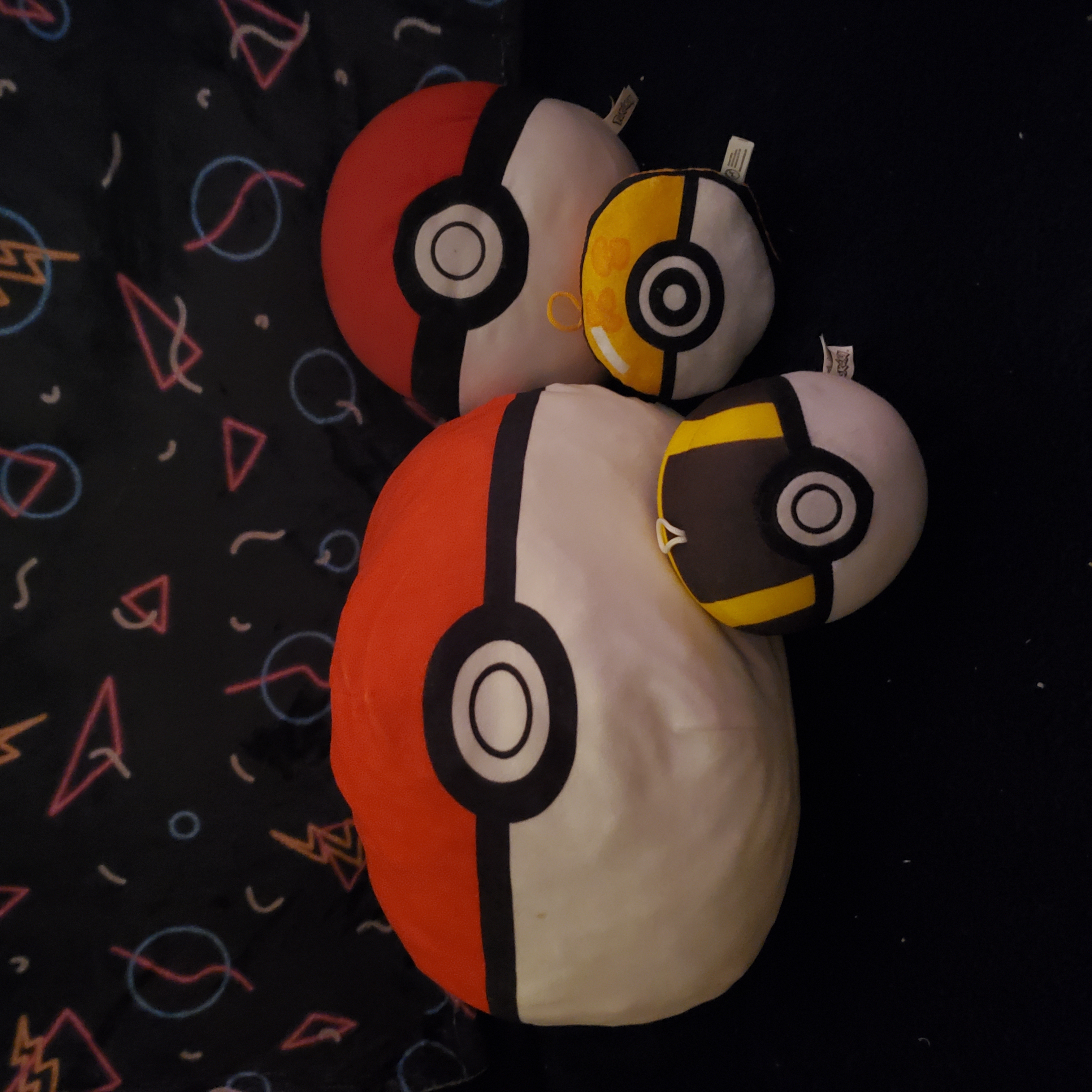 four pokeball plush