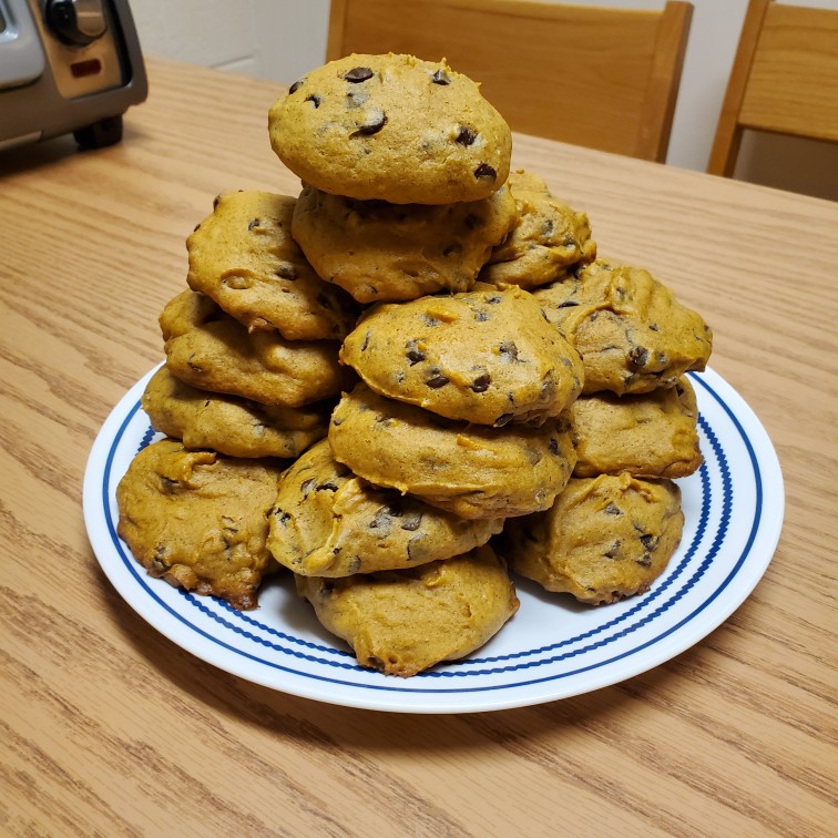 pile of pumpkin cookies on a plate