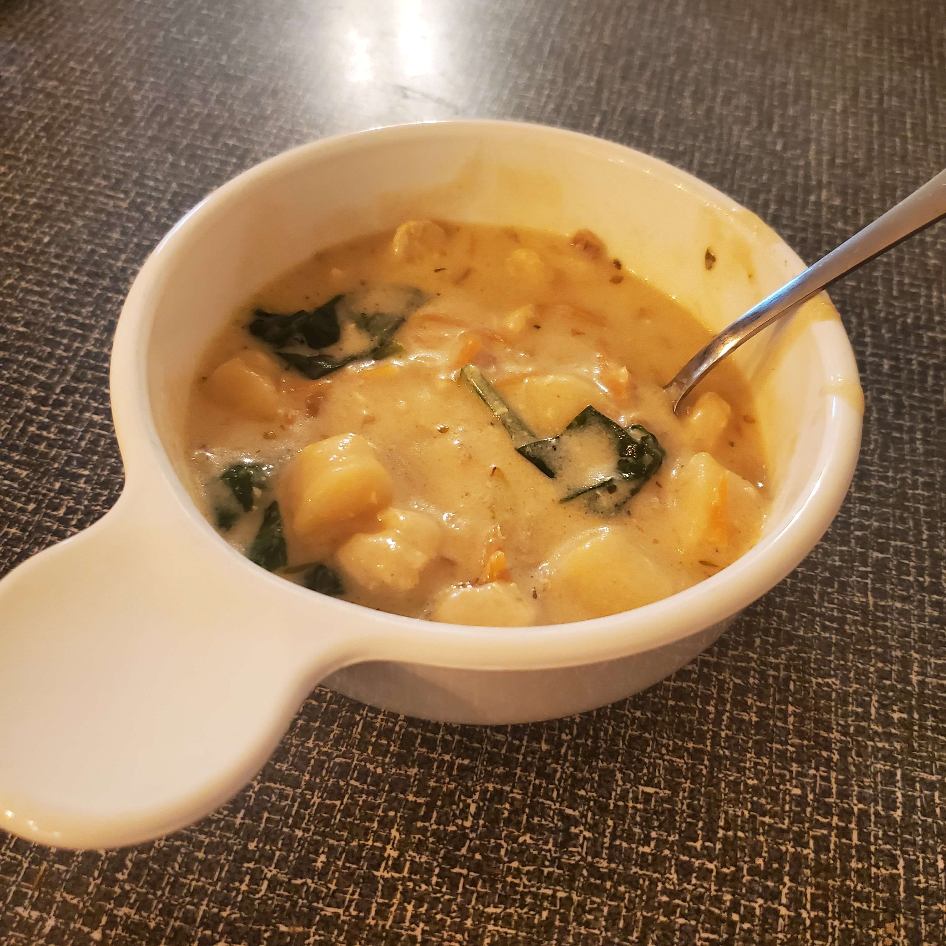 chicken gnocchi soup in a white bowl