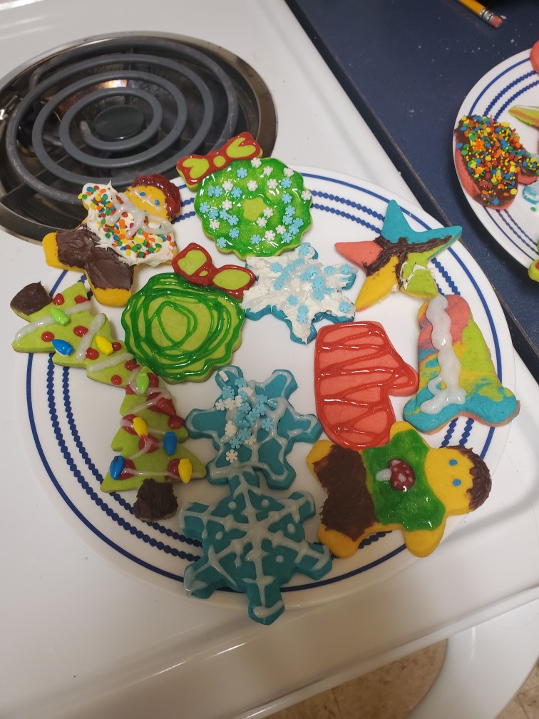 plate full of brightly colored sugar cookies